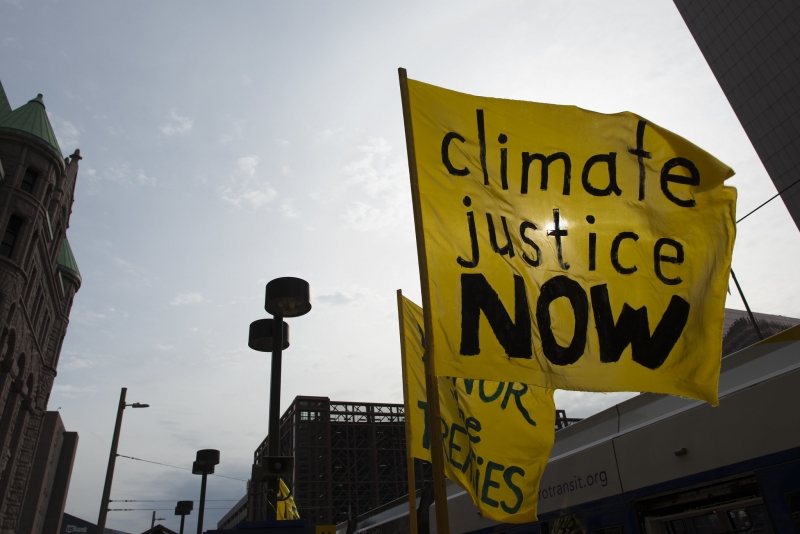 Climate justice now protest sign