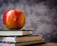 Apple on stack of books