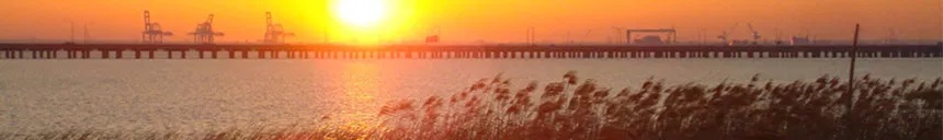 Oil rigs in the Gulf of Mexico against the sunset.