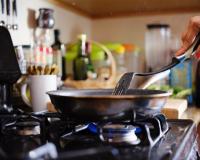 Cooking over a stovetop/Joshua Resnick/Shutterstock