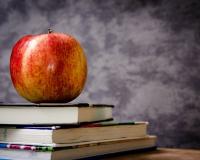 Apple on stack of books