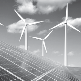 three wind turbines behind solar panels