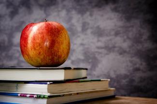 Apple on stack of books